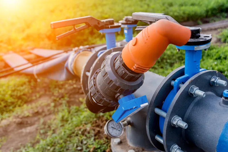 Filtration and valve assembly with pressure gauge on an irrigation mainline